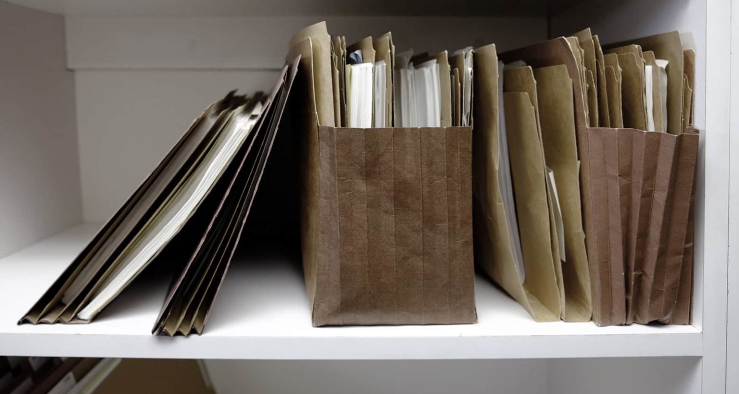 Business files in boxes folders and shelf papers